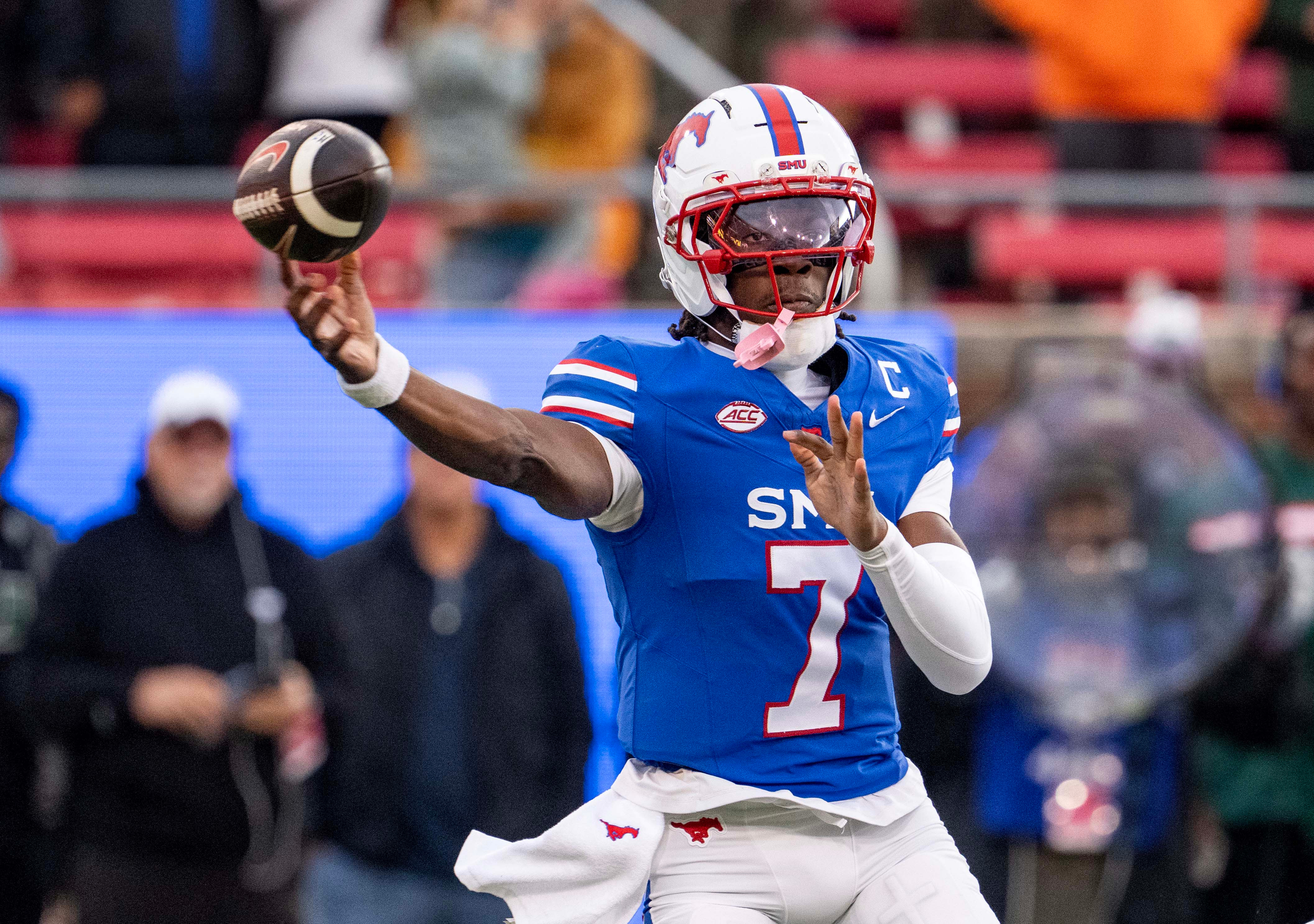 SMU quarterback Kevin Jennings throws a pass during the first half of an NCAA college football game against Miami, Saturday, Nov. 1, 2025, in Dallas. 