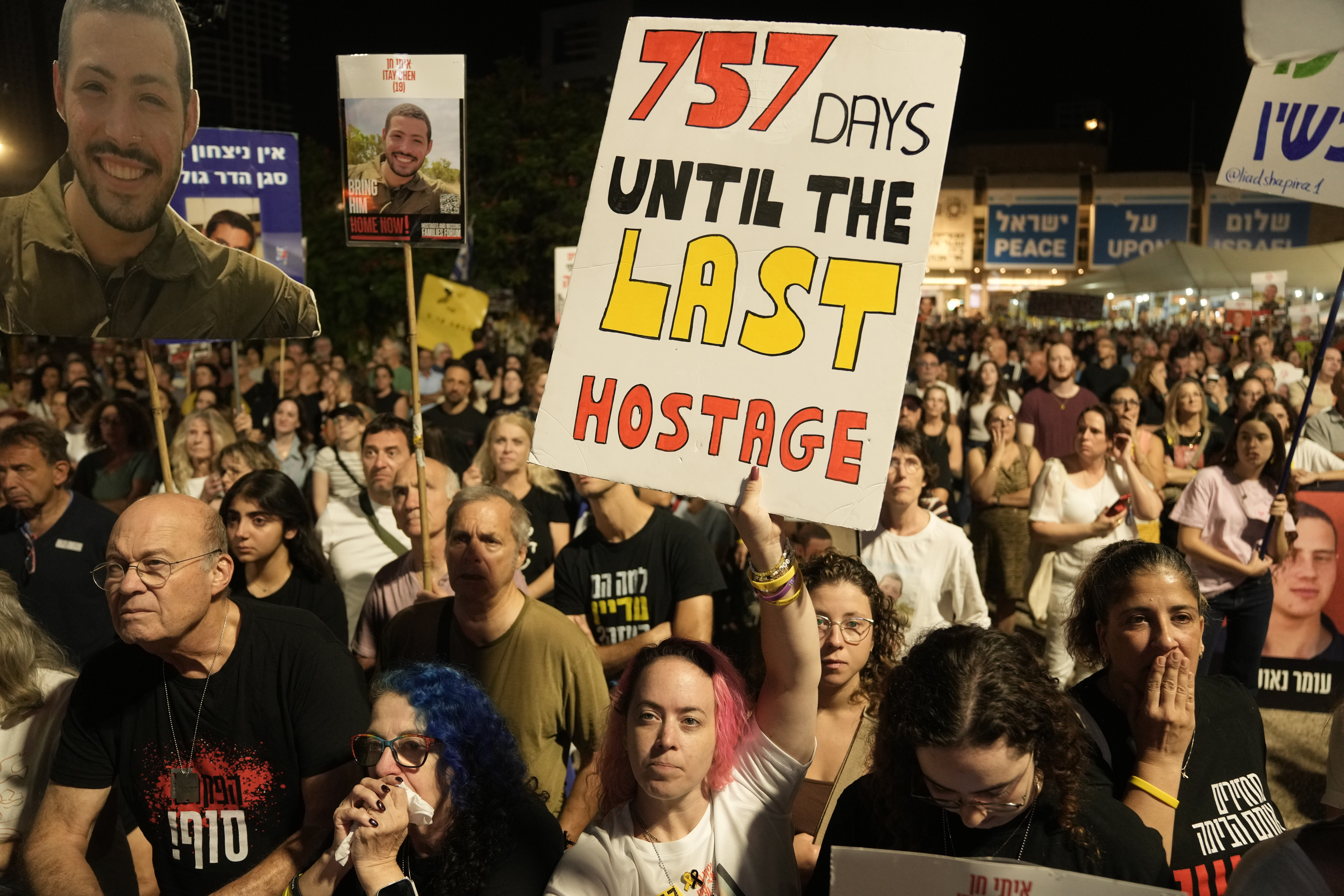 Relatives and supporters of hostages held by Hamas in the Gaza Strip attend a rally in Tel Aviv, Israel, Saturday. Questions around the future of postwar Gaza still remain as a fragile ceasefire continues to hold.