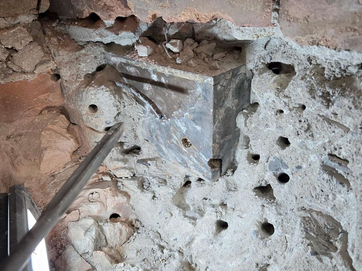Workers drilled through bricks, concrete and rebar to extract a time capsule from the cornerstone at the 101-year-old Japanese Church of Christ in Salt Lake City on Aug. 26.