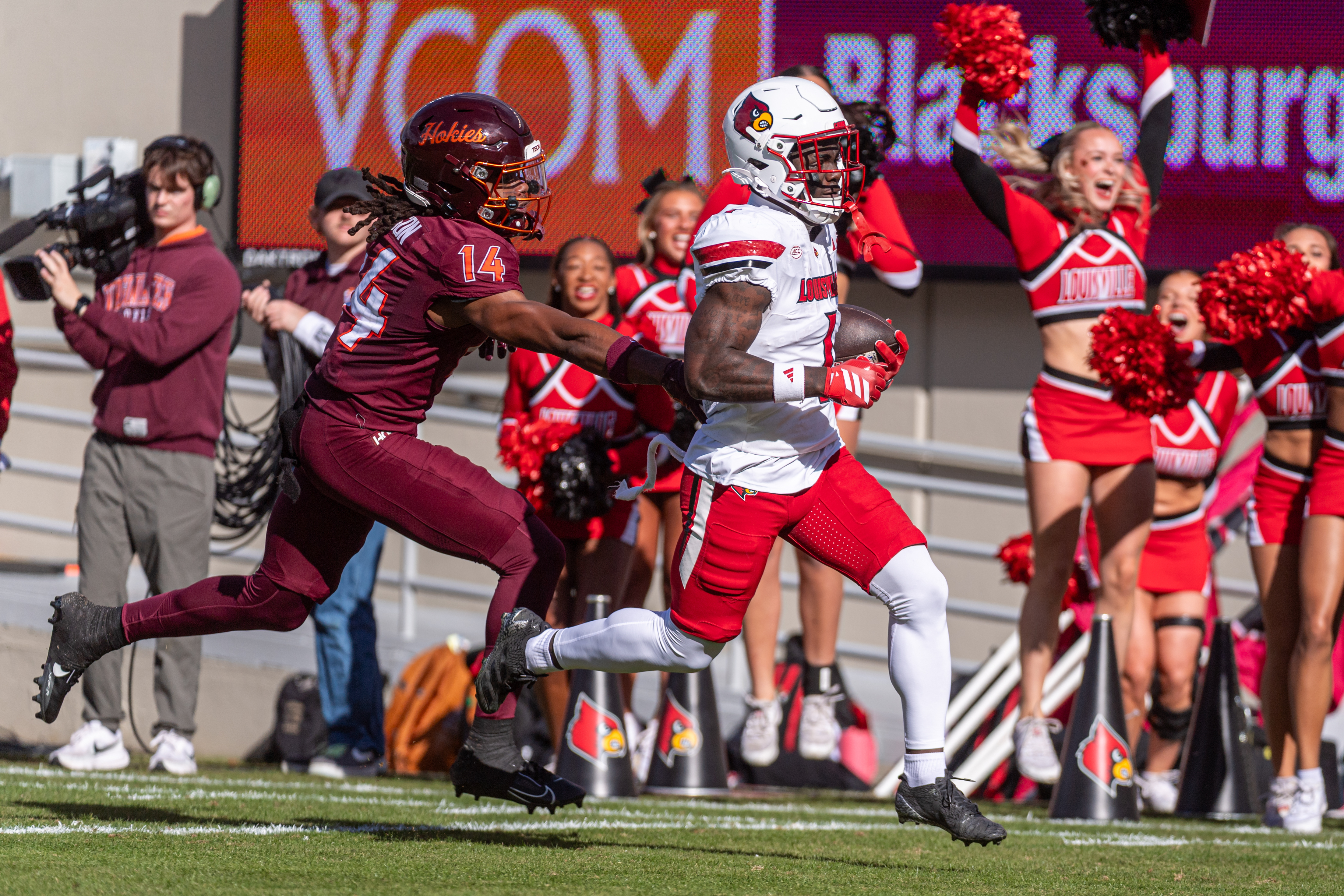Louisville running back Isaac Brown (1) runs downfield against Virginia Tech during the first half of an NCAA college football game, Saturday, Nov. 1, 2025, in Blacksburg, Va. 