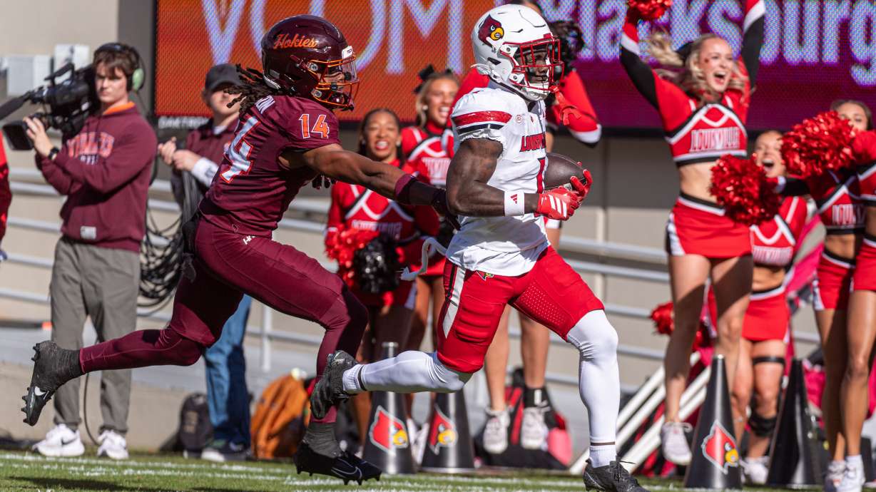 Louisville running back Isaac Brown (1) runs downfield against Virginia Tech during the first half of an NCAA college football game, Saturday, Nov. 1, 2025, in Blacksburg, Va.