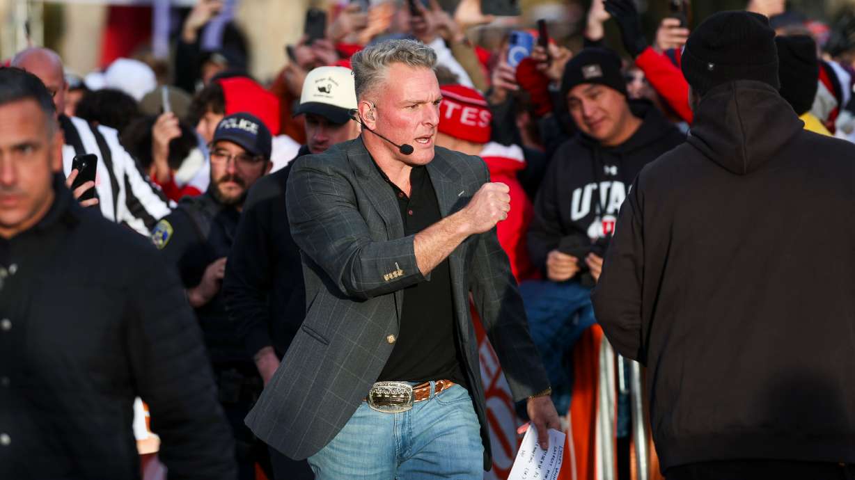 Pat McAfee fist bumps TV crew as they prepare for Pat McAfee’s Kicking Contest during ESPN’s “College GameDay” in the President's Circle at the University of Utah in Salt Lake City on Saturday, Nov. 1, 2025.