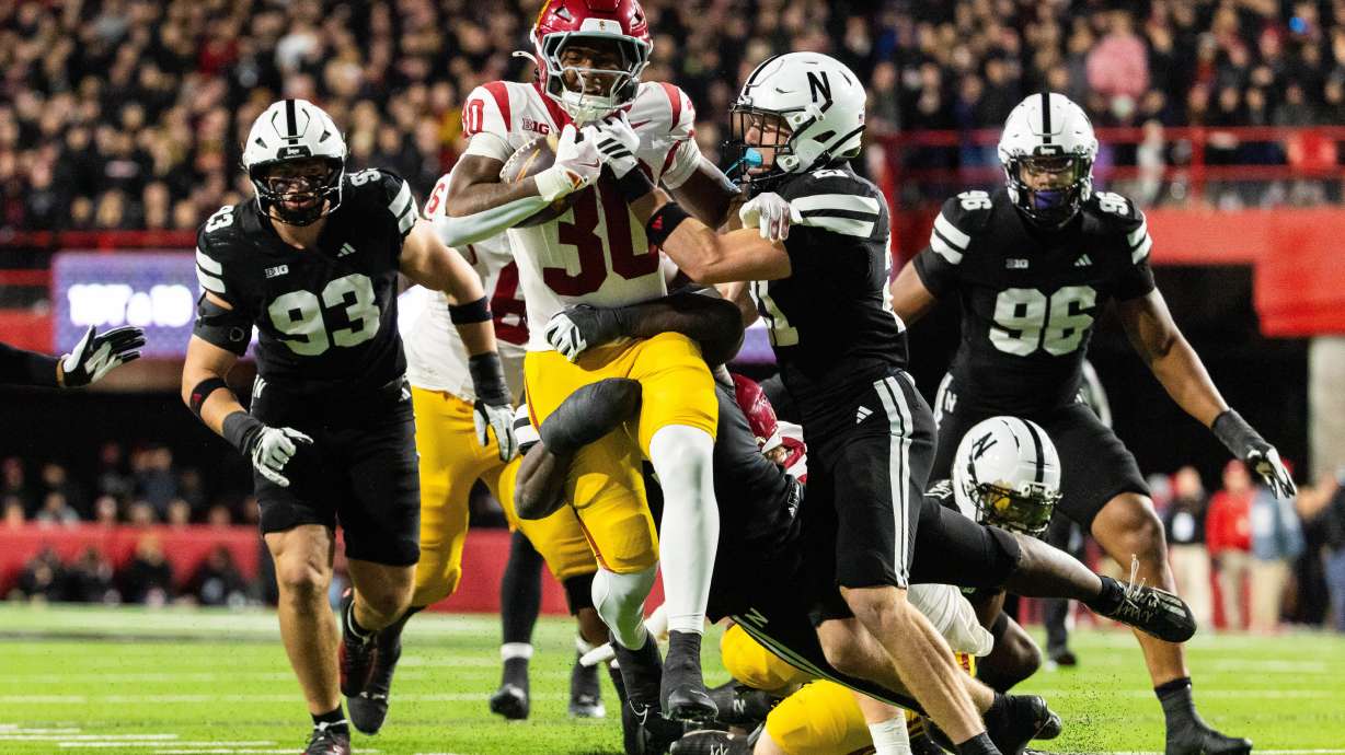 Southern California running back King Miller (30) carries the ball against Nebraska defensive back Rex Guthrie (21) during the second half of an NCAA college football game, Saturday, Nov. 1, 2025, in Lincoln, Neb.