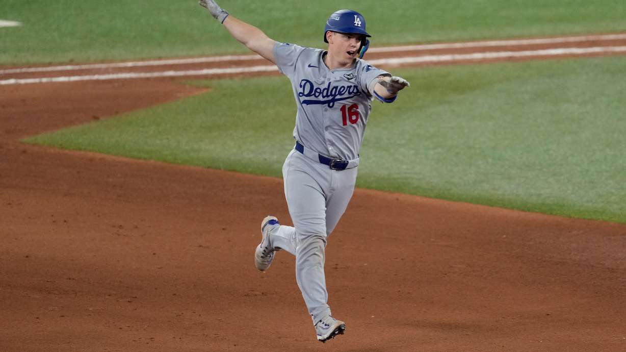 Los Angeles Dodgers' Will Smith celebrates his home run against the Toronto Blue Jays during the 11th inning in Game 7 of baseball's World Series, Sunday, Nov. 2, 2025, in Toronto.