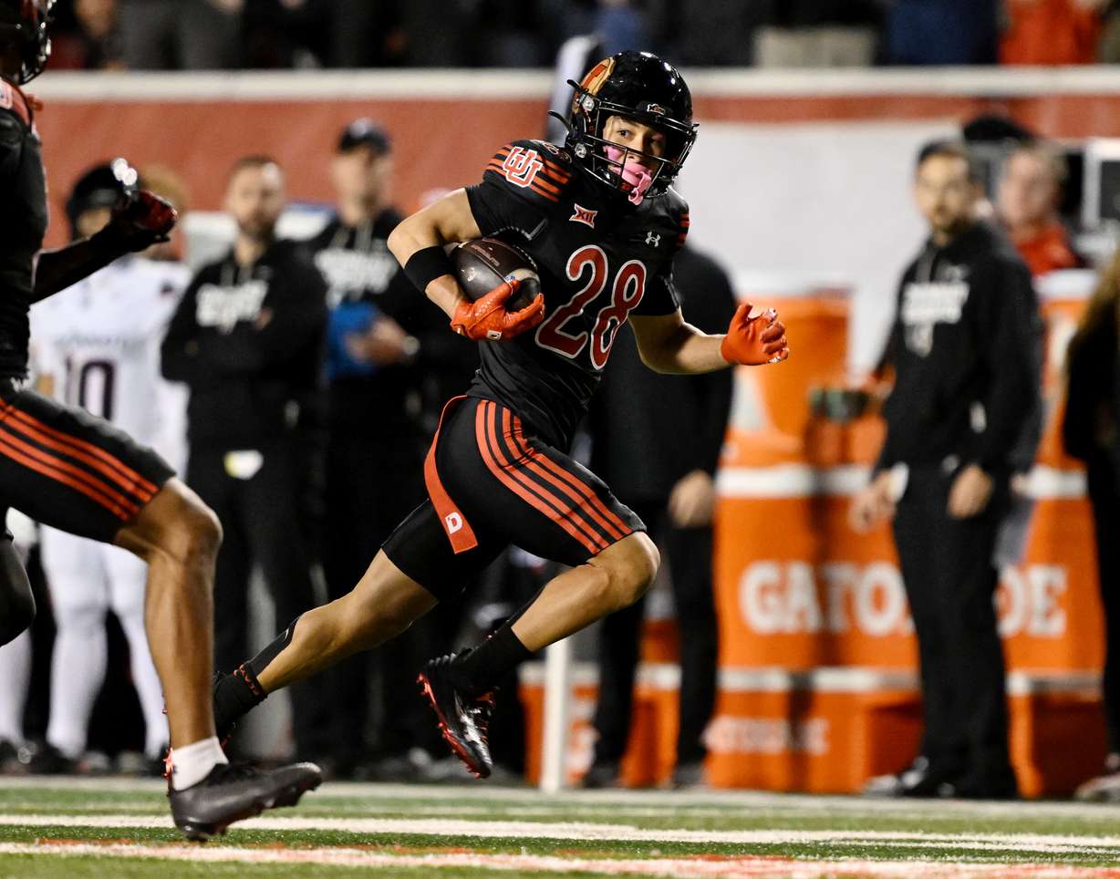 Utah Utes wide receiver Mana Carvalho (28) looks to his right during a punt return for a touchdown as Utah and Cincinnati play at Rice Eccles Stadium in Salt Lake City on Saturday, Nov. 1, 2025.