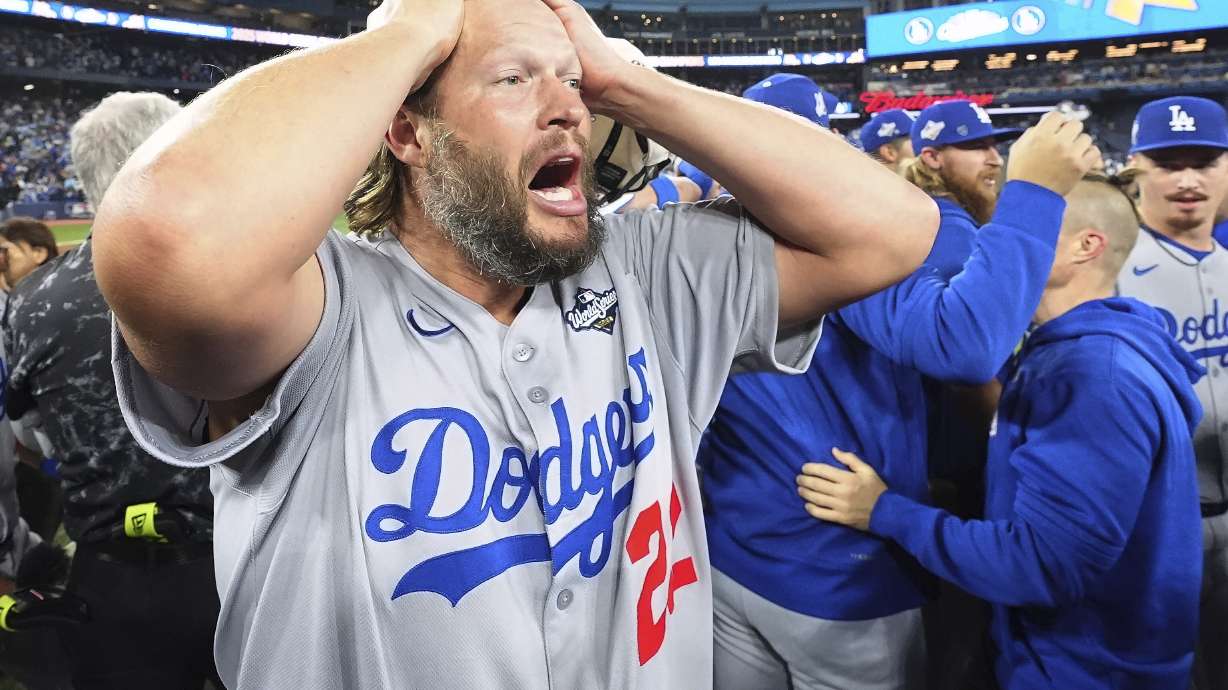 Los Angeles Dodgers pitcher Clayton Kershaw celebrates after the Dodgers defeated the Toronto Blue Jays in Game 7 of baseball's World Series, Sunday, Nov. 2, 2025, in Toronto.