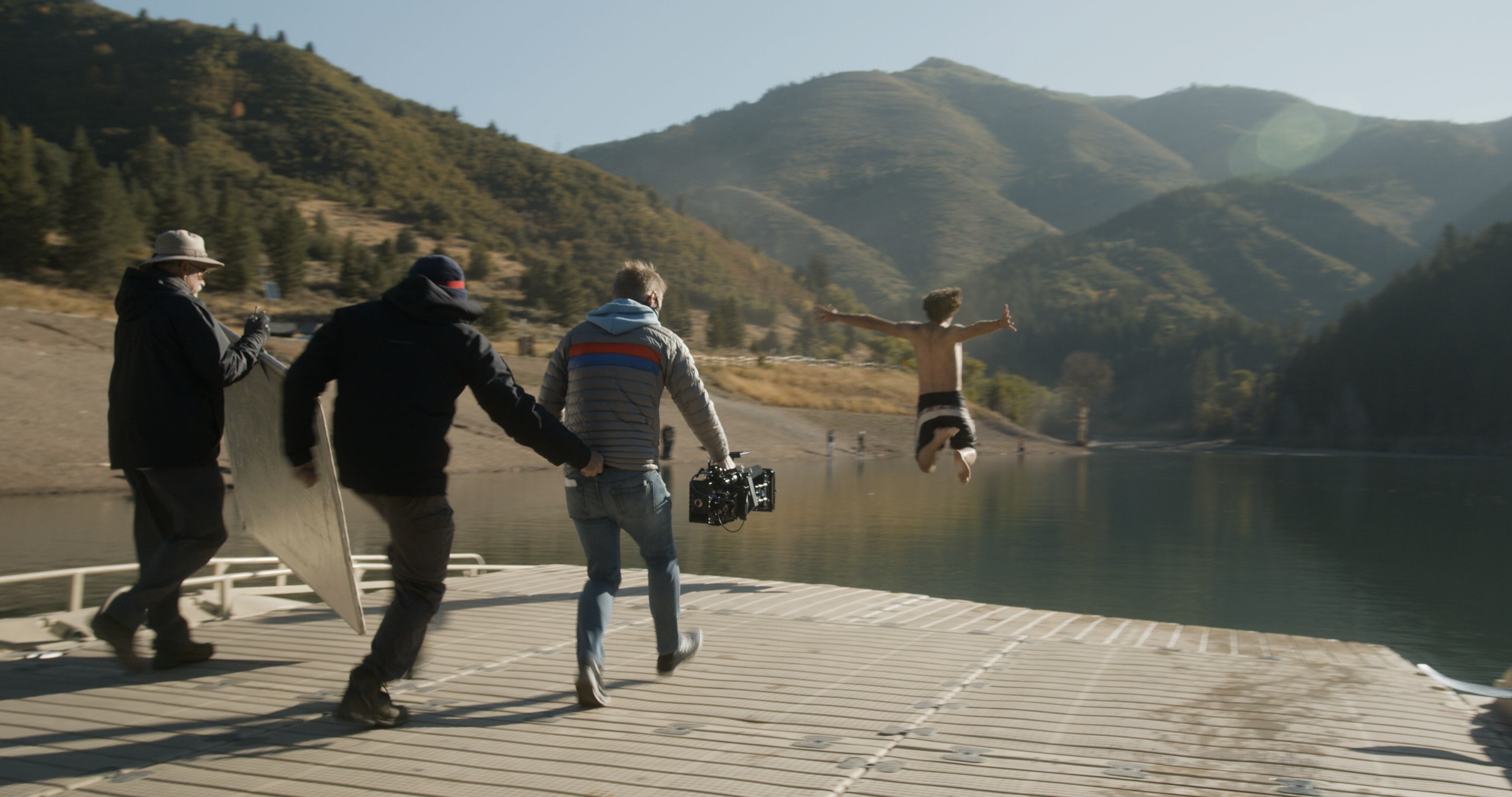 While making a commercial for iFit, Burke Lewis runs behind an actor as he jumps into the water. From an Amazon spot to the "Disagree Better" campaign, the northern Utah brothers have built their film company over the course of decades.