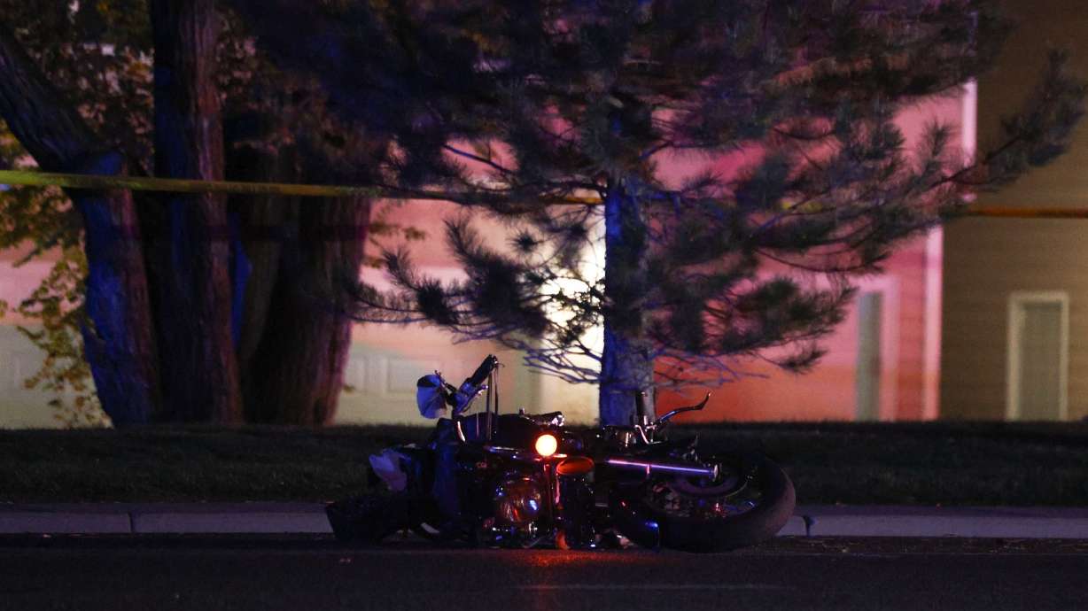 One man died Sunday night after the driver of a car, who police say was fleeing a traffic accident, collided with a motorcycle.