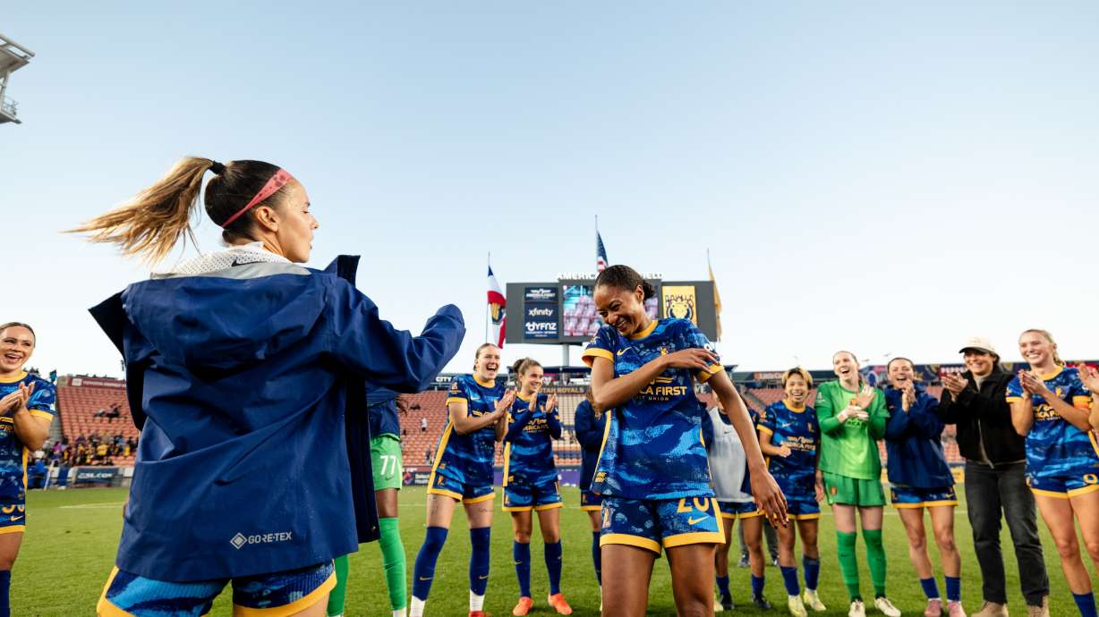 Utah Royals defender Imani Dorsey, center, celebrates with teammate Claudia Zornoza after the two played their final professional match, Sunday, Nov. 2, 2025 at America First Field in Sandy, Utah.