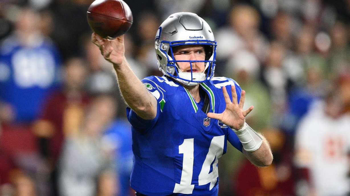 Seattle Seahawks quarterback Sam Darnold (14) passes the ball during the first half of an NFL football game against Washington Commanders, Sunday, Nov. 2, 2025, in Landover, Md.