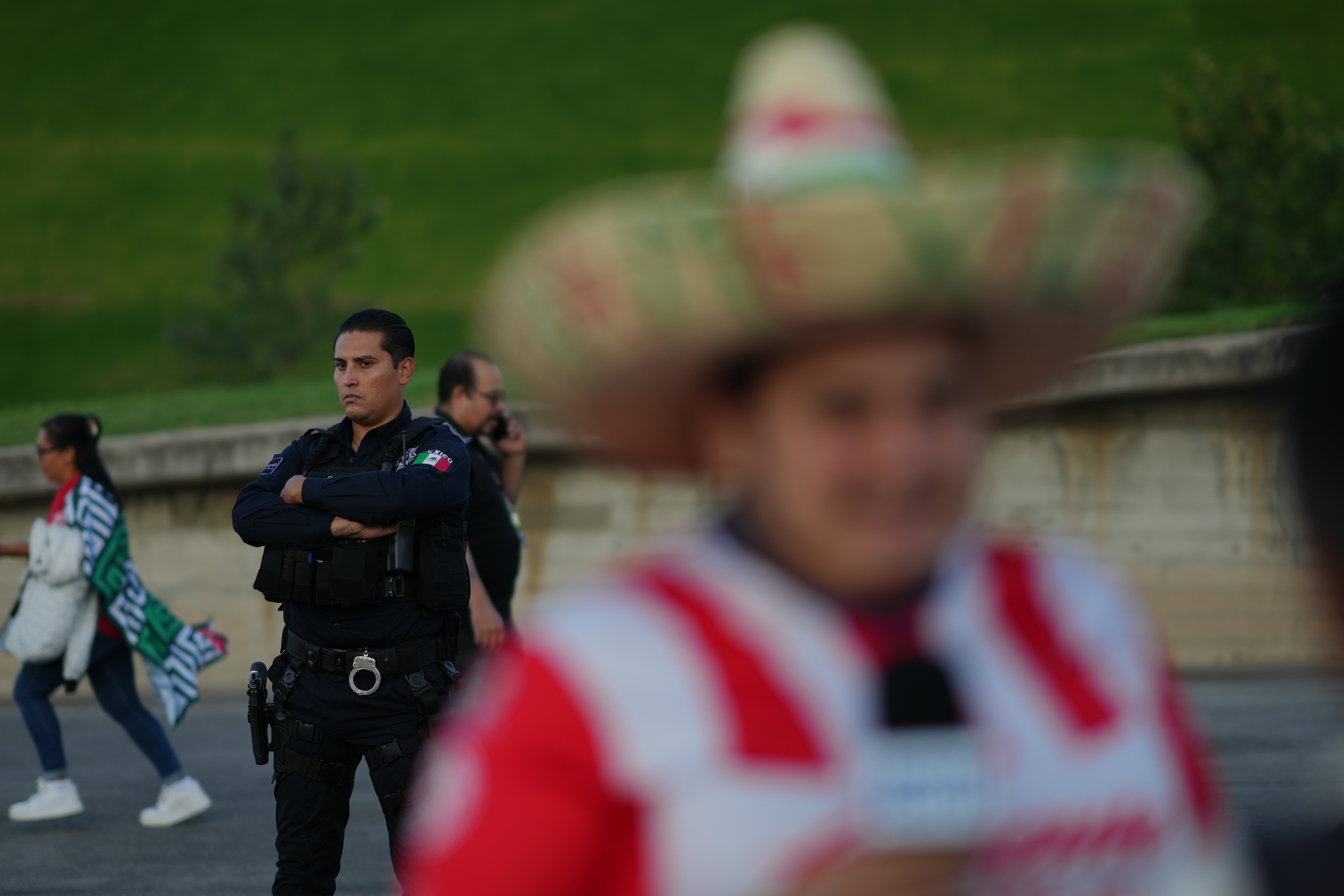A police officer stands guard outside Akron Stadium prior to a friendly match between Mexico and Ecuador in Guadalajara, Mexico, Tuesday, Oct. 14, 2025. 