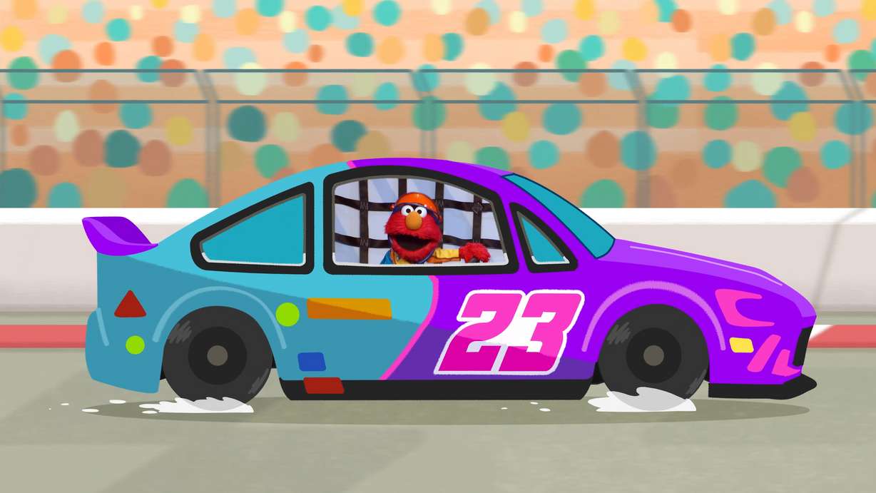 This image shows the character Elmo in a scene from "Sesame Street."