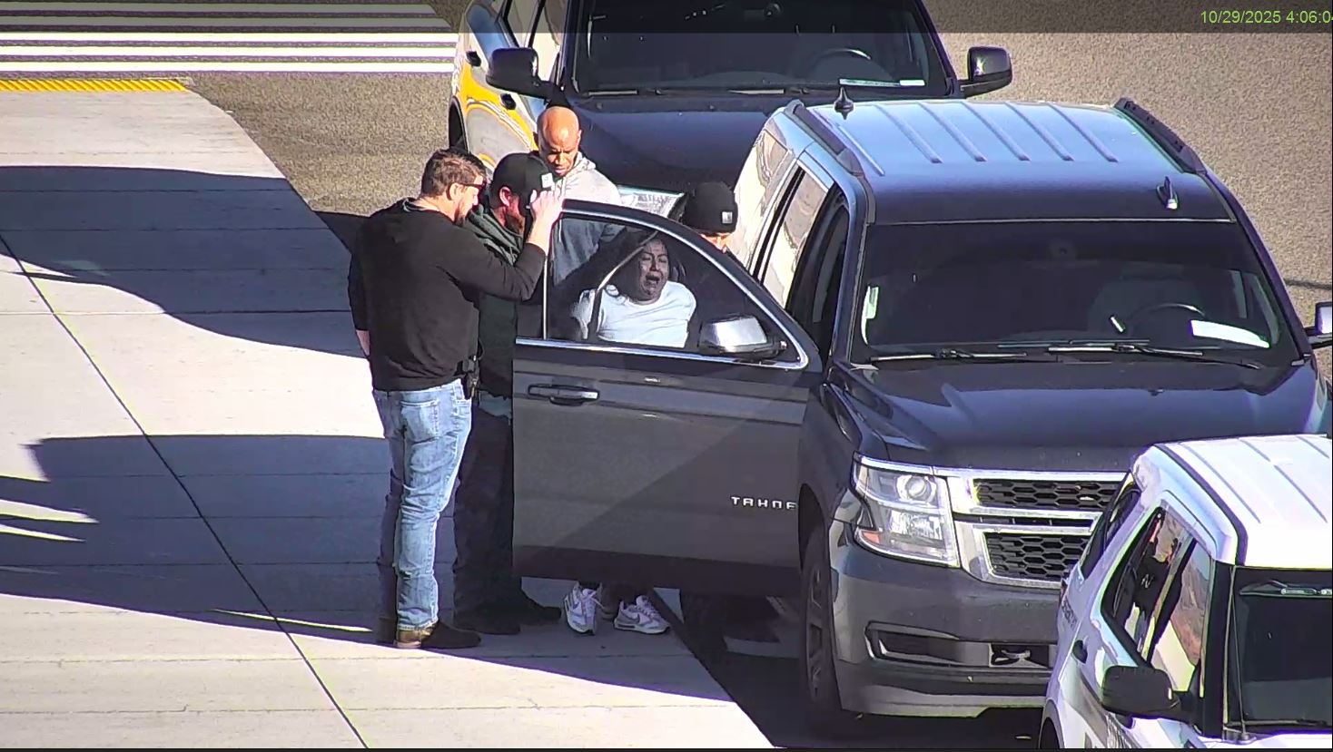 The photo from surveillance video at the Salt Lake City International Airport shows Marta Renderos Leiva being detained by federal immigration agents on Oct. 29.