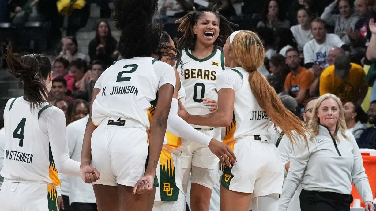 Baylor guard Taliah Scott (0) celebrates with teammates after an NCAA college basketball game against Duke Monday, Nov. 3, 2025 in Paris.