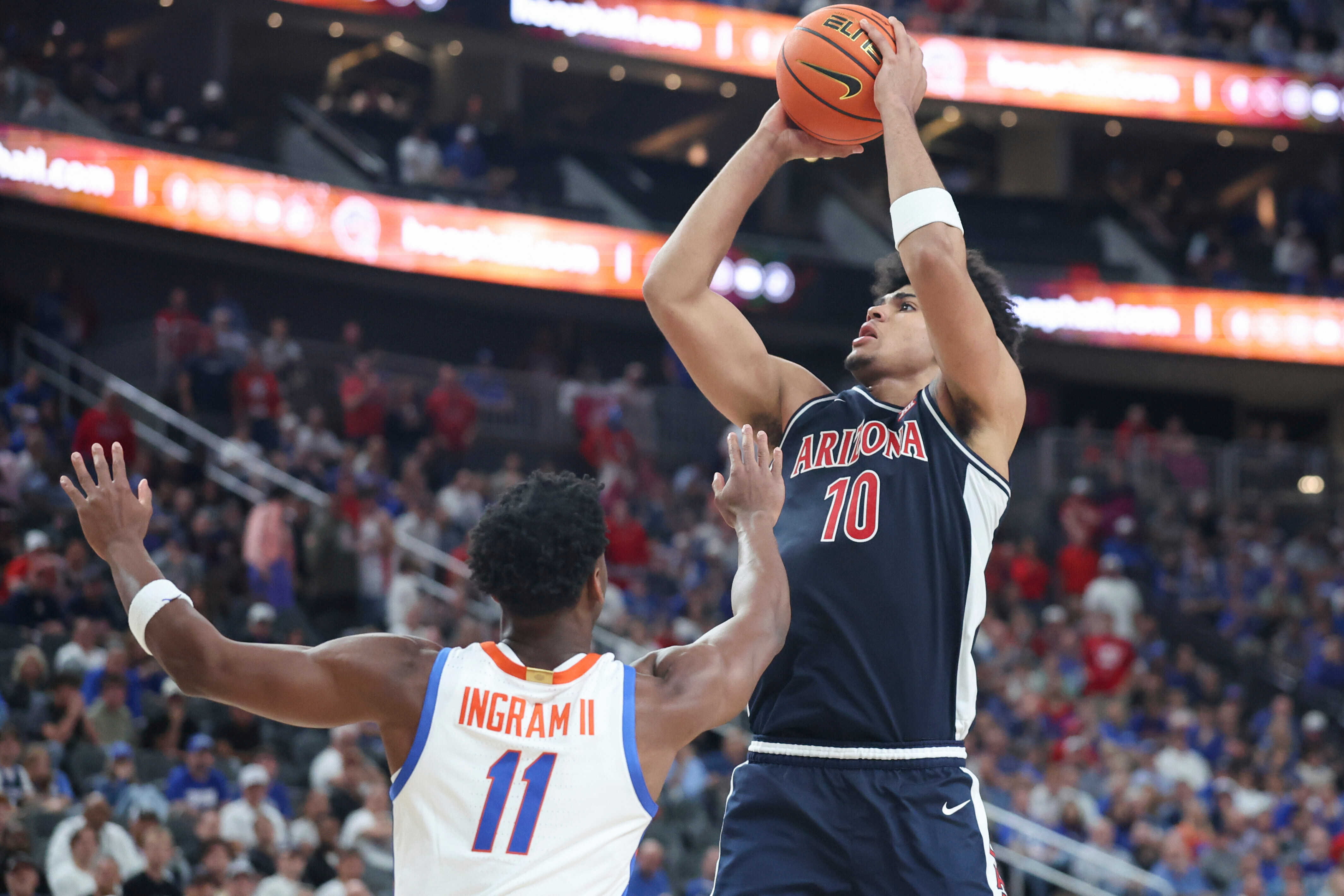 Arizona forward Koa Peat (10) shoots against Florida guard CJ Ingram (11) during the second half of an NCAA college basketball game, Monday, Nov. 3, 2025, in Las Vegas.