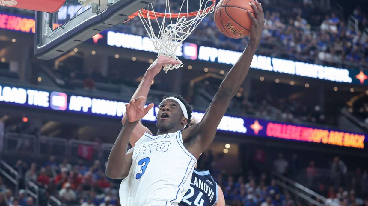 BYU forward AJ Dybantsa (3) shoots against Villanova forward Duke Brennan during the first half of an NCAA college basketball game, Monday, Nov. 3, 2025, in Las Vegas.