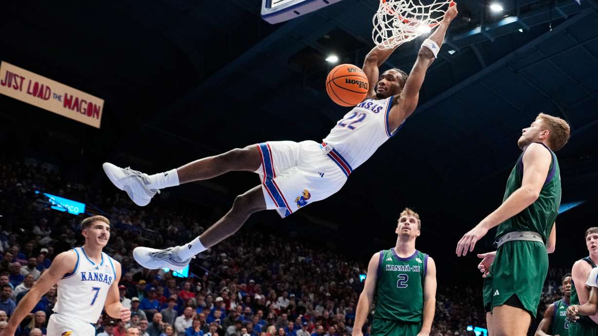 Kansas guard Darryn Peterson dunks the ball during the first half of an NCAA college basketball game against the Green Bay, Monday, Nov. 3, 2025, in Lawrence, Kan.