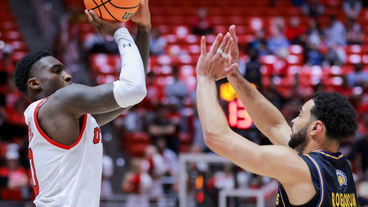 Utah forward Seydou Traore (0) shoots over San Jose State Spartans guard Ben Roseborough (11) during the second half of the game at the Jon M. Huntsman Center in Salt Lake City on Monday, Nov. 3, 2025.