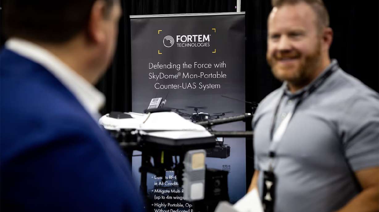 Jeff Gardner, vice president of solutions for Fortem Technologies, right, talks with Jon Gruen, CEO of Fortem Technologies, left, at the 2025 Zero Gravity Summit hosted by 47G Utah Aerospace & Defense at the Salt Palace Convention Center in Salt Lake City on Tuesday.