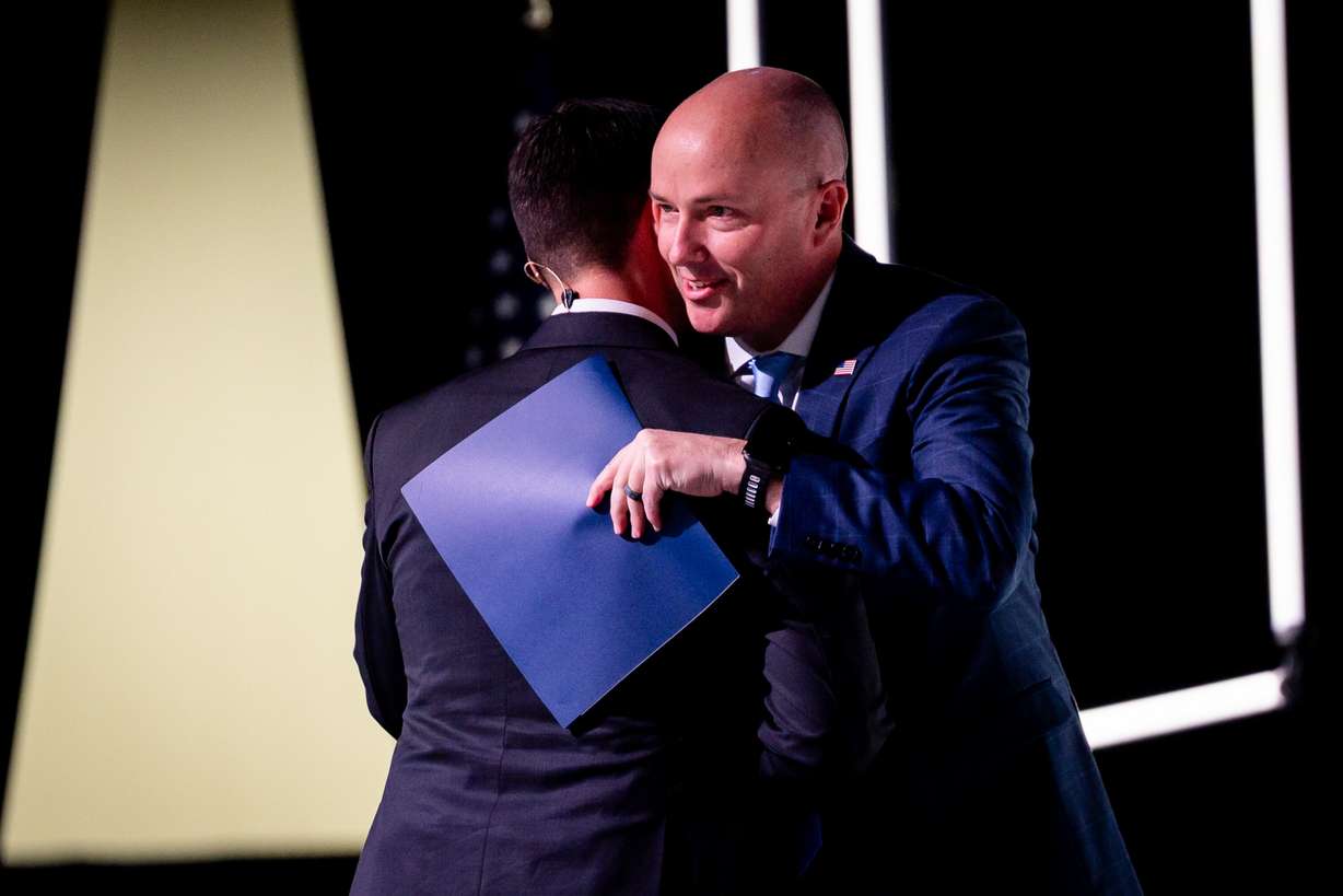 Aaron Starks, CEO and president of 47G, left, embraces Gov. Spencer Cox, right, before he speaks at the 2025 Zero Gravity Summit hosted by 47G Utah Aerospace & Defense at the Salt Palace Convention Center in Salt Lake City on Tuesday.