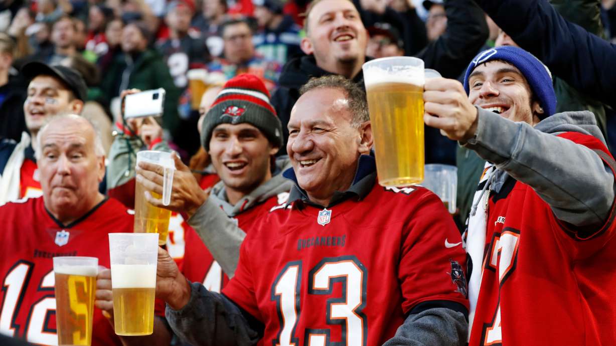 FILE - Fans cheer during an NFL football game between the Tampa Bay Buccaneers and the Seattle Seahawks at Allianz Arena in Munich, Germany, Nov. 13, 2022.