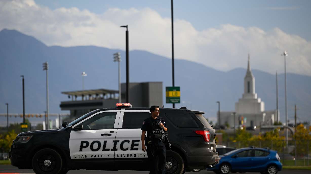 A law enforcement officer stands outside Utah Valley University on Sept. 10, in Orem. The university announced on Thursday it is expanding its police force and adding security managers.