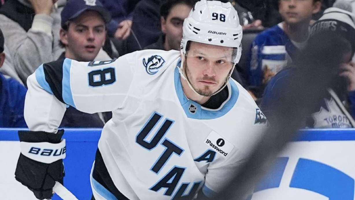 Mikhail Sergachev looks to pass the puck in Toronto.