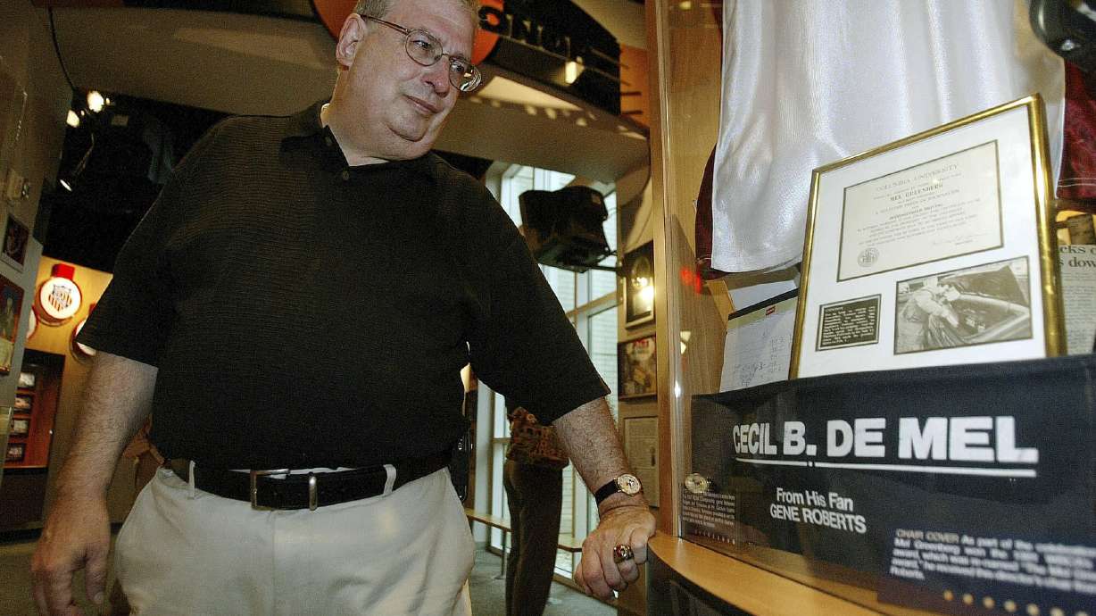 FILE - Philadelphia Inquirer sportswriter Mel Greenberg looks at a display honoring him during a tour of the Women's Basketball Hall of Fame, Friday, June 8, 2007, in Knoxville, Tenn.