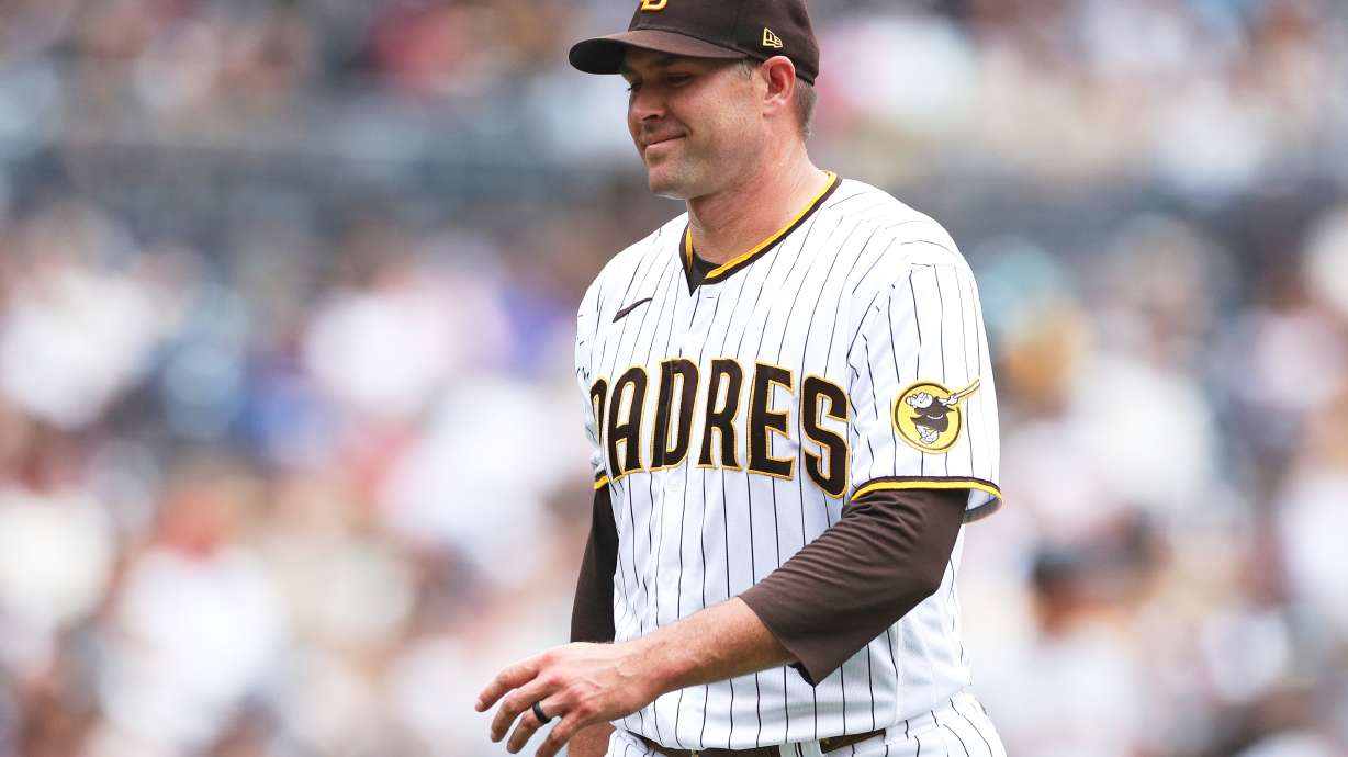 FILE - San Diego Padres' Craig Stammen smiles as he walks towards his dugout during a baseball game against the San Francisco Giants, Oct. 5, 2022, in San Diego.