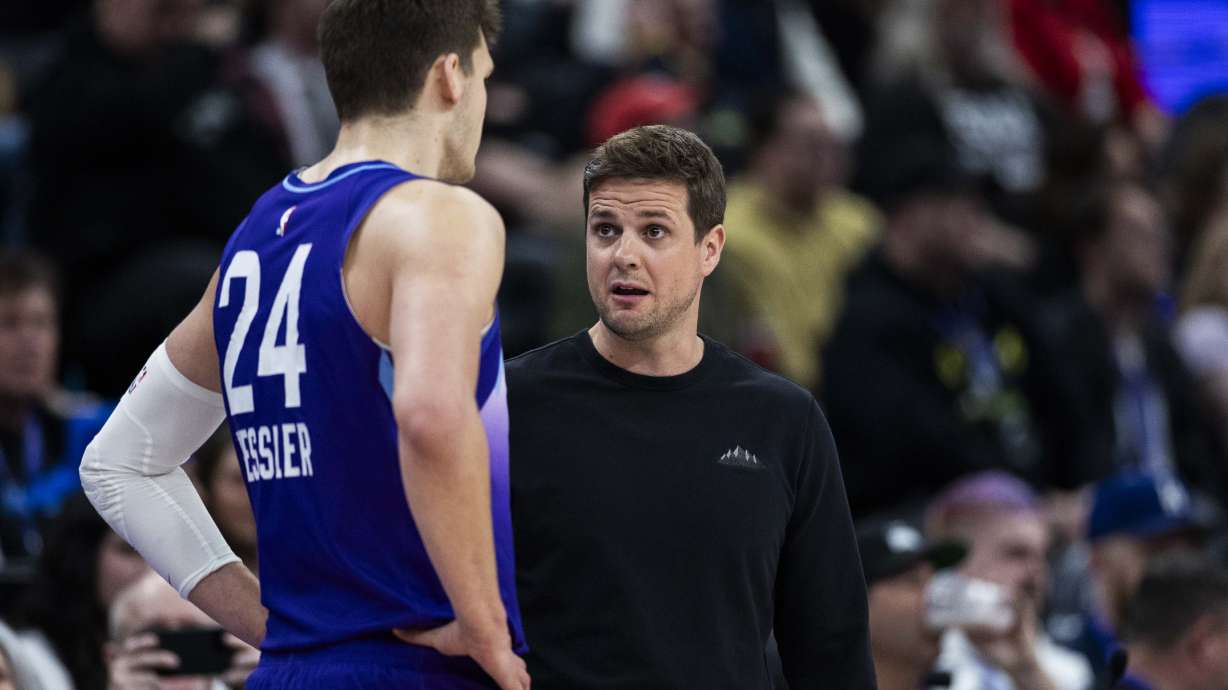 Jazz head coach Will Hardy talks with center Walker Kessler (24) during a NBA game against the Houston Rockets at the Delta Center in Salt Lake City on Saturday, Feb. 22, 2025.