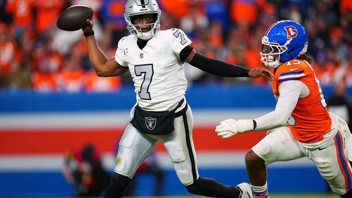 Las Vegas Raiders quarterback Geno Smith (7) throws under pressure from Denver Broncos outside linebacker Nik Bonitto (15) during the second half of an NFL football game Thursday, Nov. 6, 2025, in Denver.