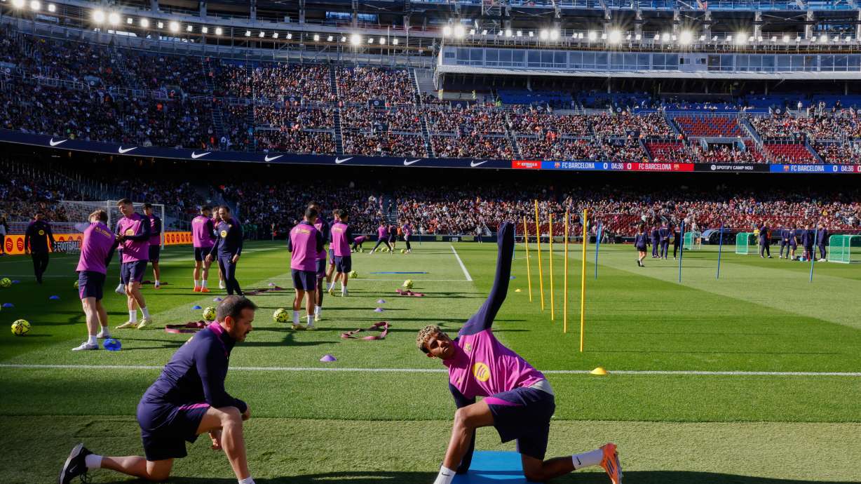 Barcelona's Lamine Yamal exercises during the team's first training session at the venue after its renovation at the Camp Nou stadium in Barcelona, Spain, Friday, Nov. 7, 2025.