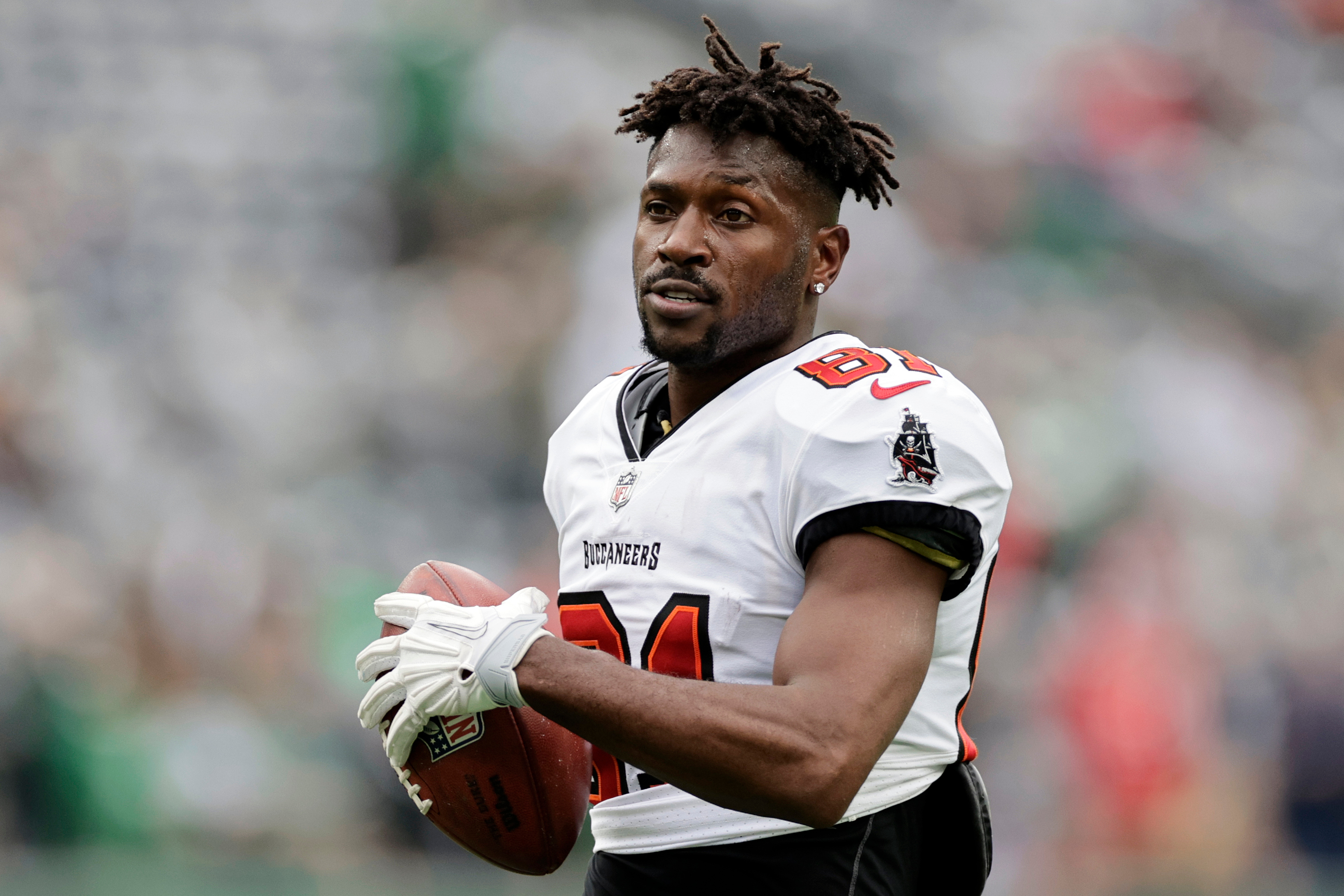 FILE - Tampa Bay Buccaneers wide receiver Antonio Brown (81) walks on the field during an NFL football game against the New York Jets, Jan. 2, 2022, in East Rutherford, N.J.