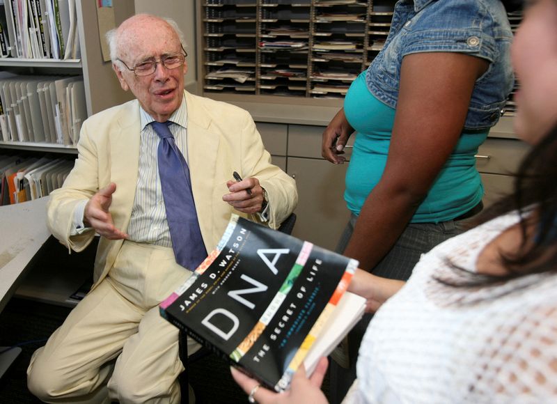 James D. Watson, co-discoverer of the DNA helix and father of the Human Genome Project, prepares to autograph his book for a researcher at the Baylor College of Medicine's Human Genome Sequencing Center in Houston, May 31, 2007. Watson, who died Friday at age 97, called his greatest heroes writers.