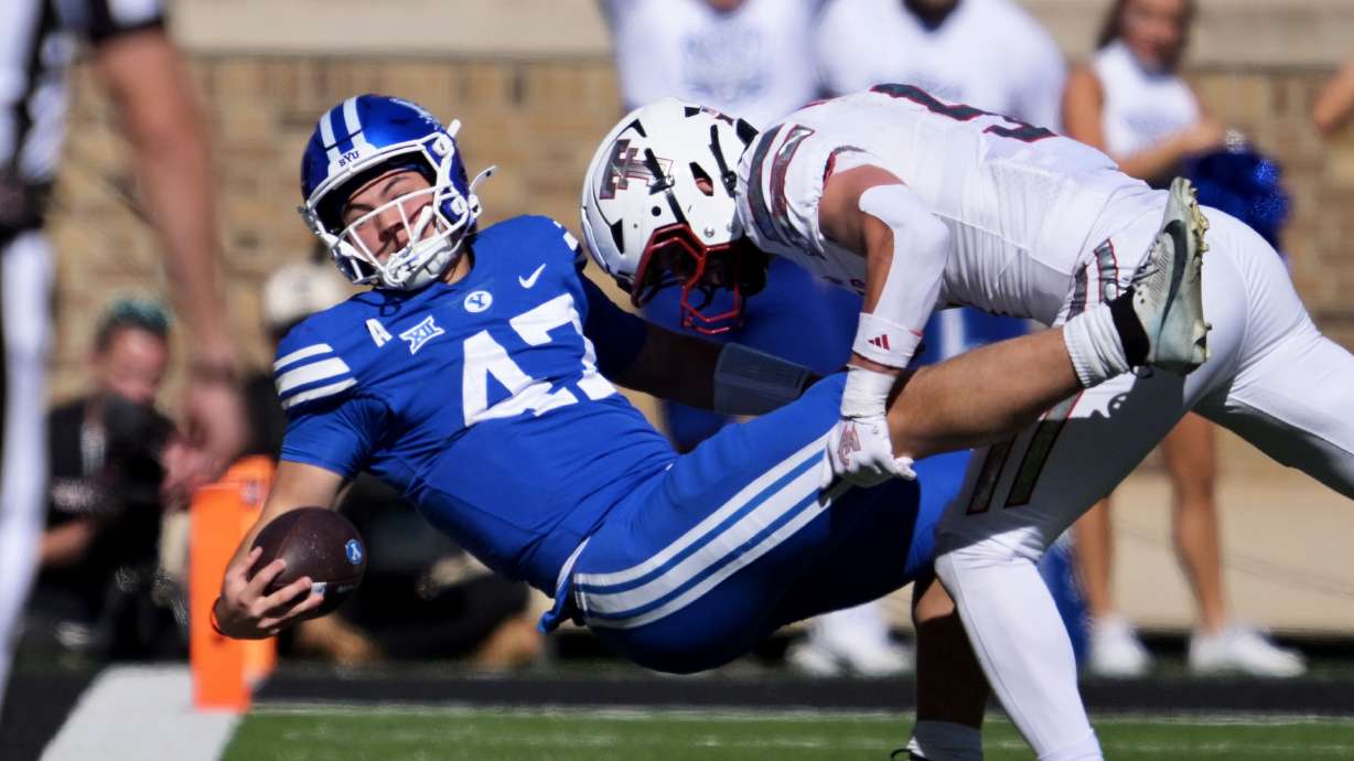 BYU Cougars quarterback Bear Bachmeier (47) is driven to the ground by Texas Tech Red Raiders safety Cole Wisniewski (5) as they play at Jones AT&T Stadium in Lubbock Texas on Saturday, Nov. 8, 2025.
