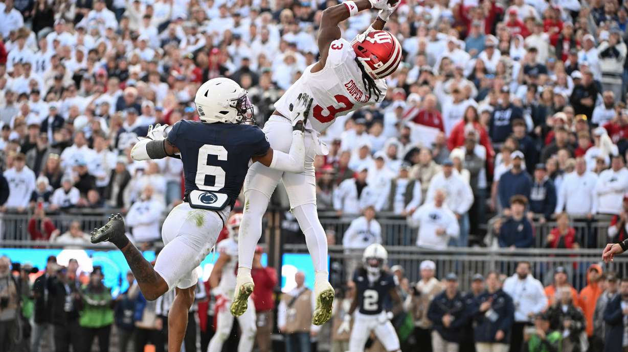 Indiana wide receiver Omar Cooper Jr. (3) catches a touchdown pass over Penn State safety Zakee Wheatley (6) during the fourth quarter of an NCAA college football game, Saturday, Nov. 8, 2025, in State College, Pa.