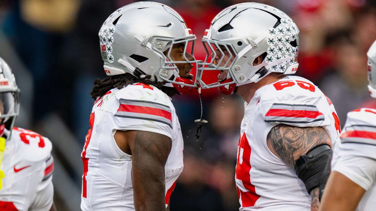 Ohio State wide receiver Jeremiah Smith (4) celebrates a touchdown with offensive lineman Ian Moore (69) during the first half of an NCAA college football game against Purdue, Saturday, Nov. 8, 2025, in West Lafayette, Ind.