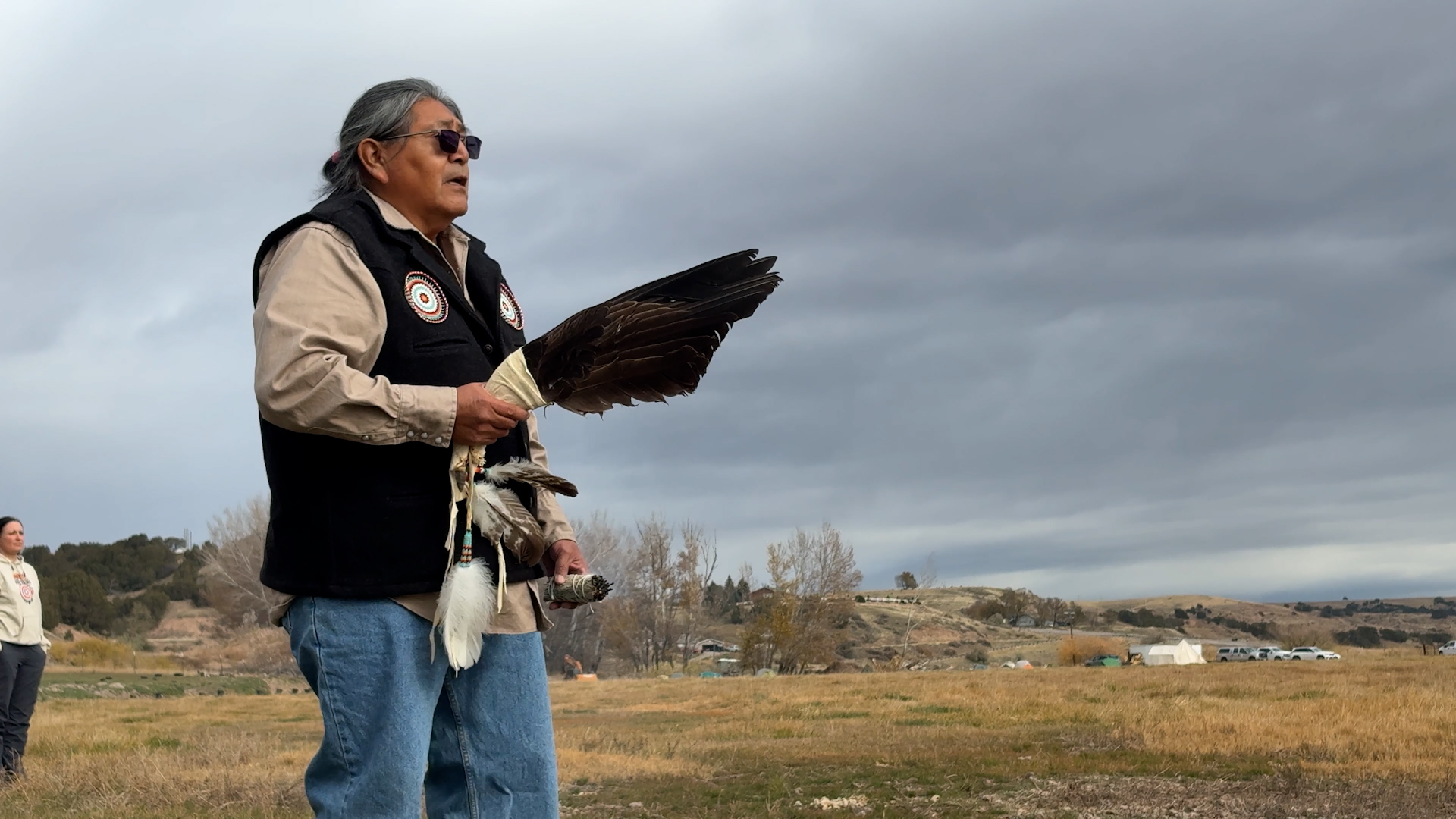 An elder with the Northwestern Band of the Shoshone Nation blesses the Bear River Massacre sight ahead of restoration work on Friday. Hundreds of volunteers also joined the effort.
