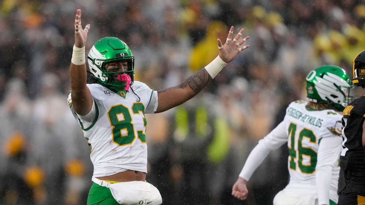 Oregon tight end Roger Saleapaga (83) celebrates a field goal during the first half of an NCAA college football game against Iowa, Saturday, Nov. 8, 2025, in Iowa City, Iowa.