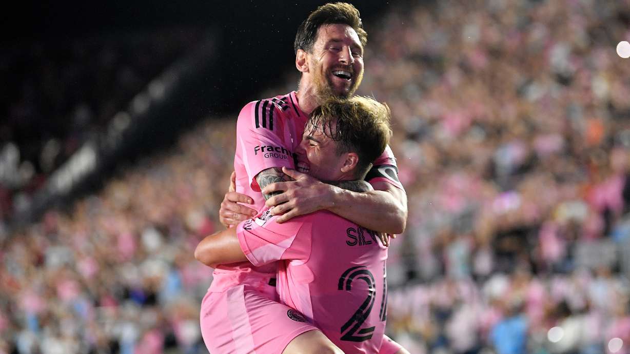 Inter Miami forward Lionel Messi, top, celebrates with forward Mateo Silvetti, bottom, after scoring during the first half of Game 3 in the first round of MLS soccer's Western Conference playoffs against Nashville SC in Fort Lauderdale, Fla., Nov. 8, 2025.