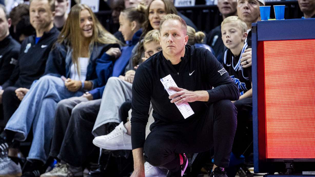 BYU head coach Kevin Young watches a play unfold against Holy Cross during an NCAA men’s basketball game held at the Marriott Center in Provo on Saturday, Nov. 8, 2025.