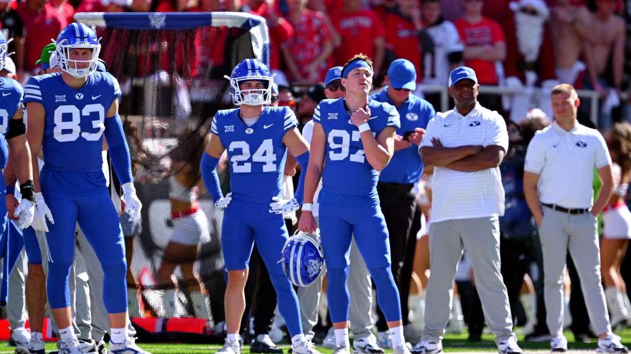 BYU players and staff watching the video replay during a penalty review as they and Texas Tech play at Jones AT&T Stadium in Lubbock, Texas, on Saturday, Nov. 8, 2025.