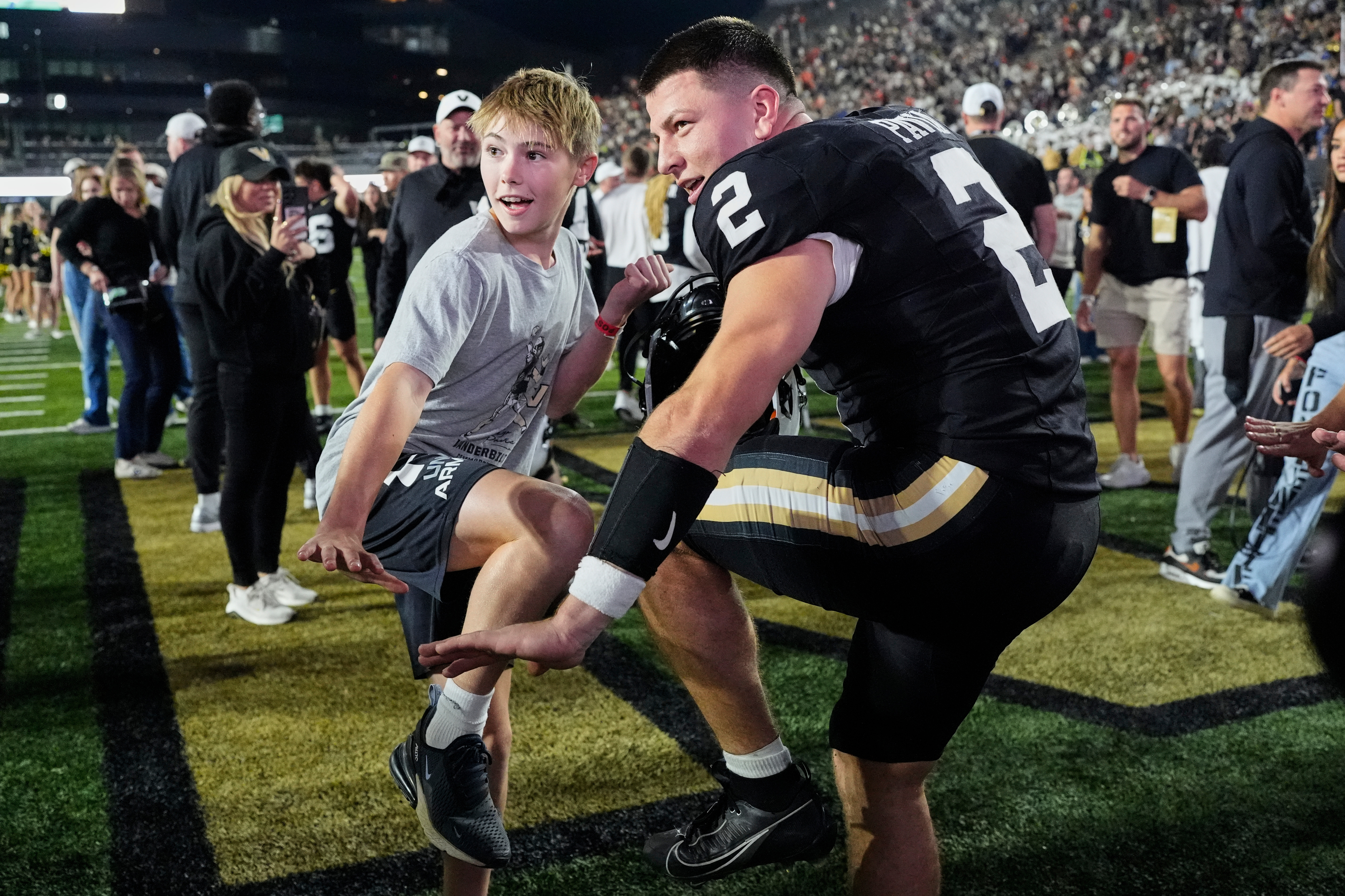 Vanderbilt quarterback Diego Pavia (2) and Xavier Swallows, left, make the Heisman pose after the team's win an NCAA college football game against Auburn, Saturday, Nov. 8, 2025, in Nashville, Tenn.