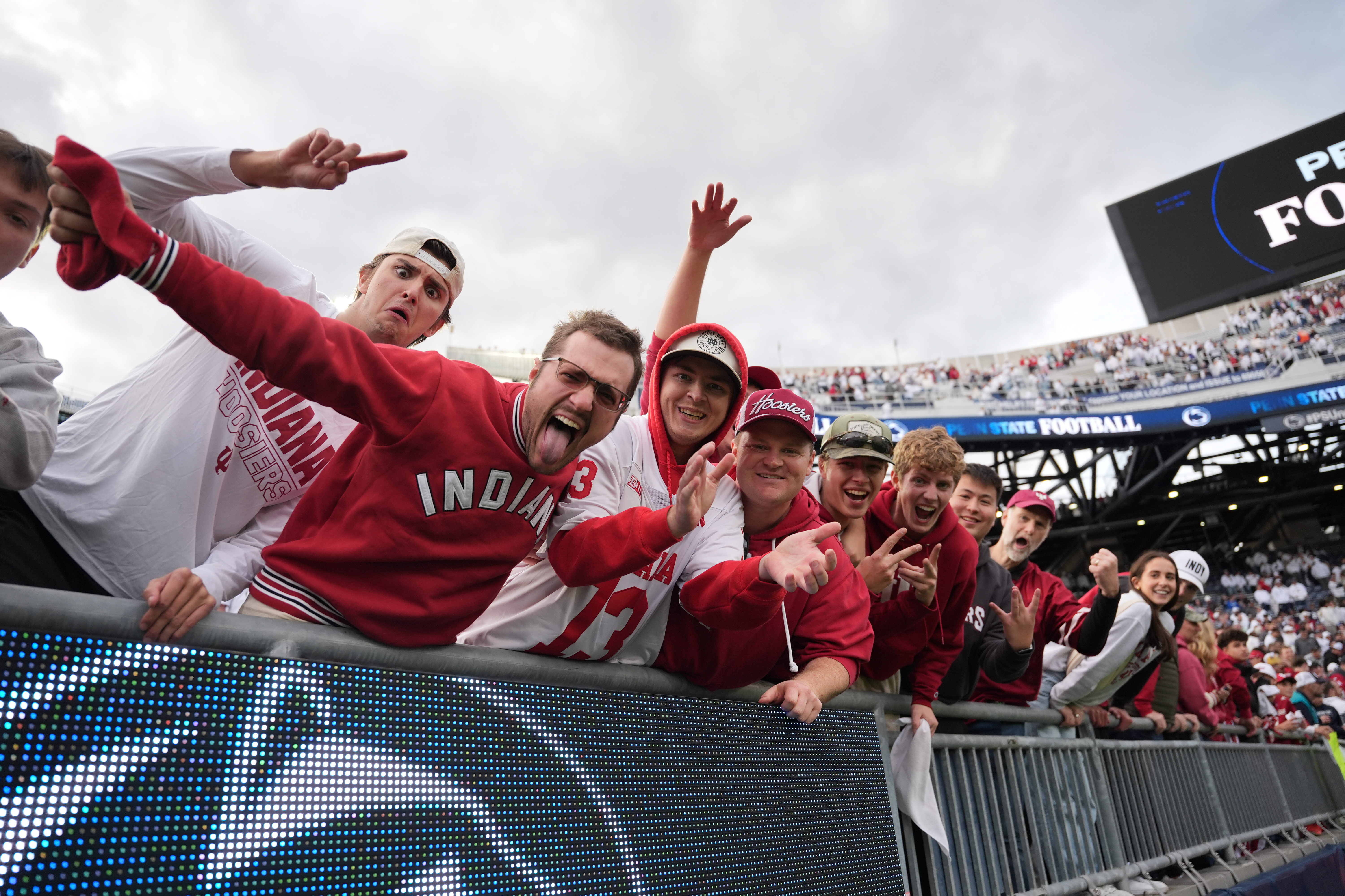 Indiana fans celebrate following an NCAA college football game against Penn State, Saturday, Nov. 8, 2025, in State College, Pa.