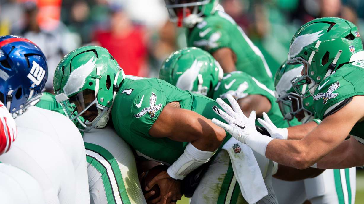 FILE - Philadelphia Eagles quarterback Jalen Hurts runs the "tush push" play during an NFL football game against the New York Giants, Oct. 26, 2025, in Philadelphia.