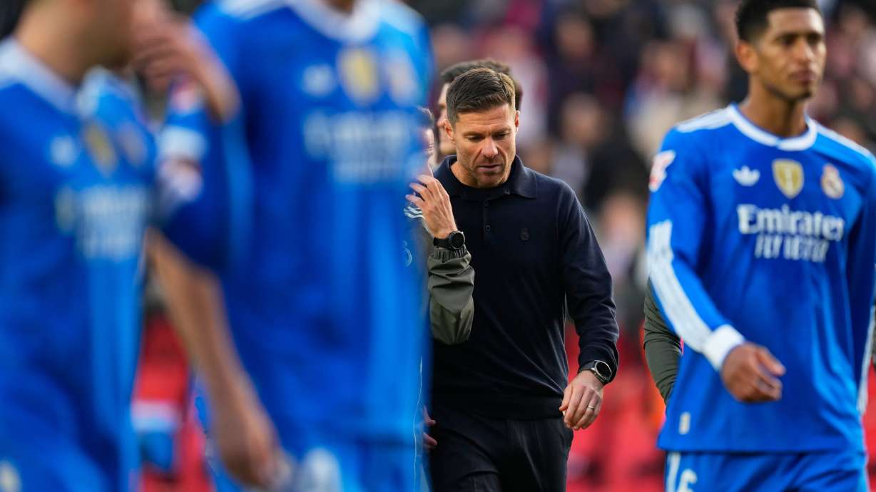 Real Madrid's head coach Xabi Alonso walks with the players during a Spanish La Liga soccer match between Rayo Vallecano and Real Madrid in Madrid, Spain, Sunday, Nov. 9, 2025.