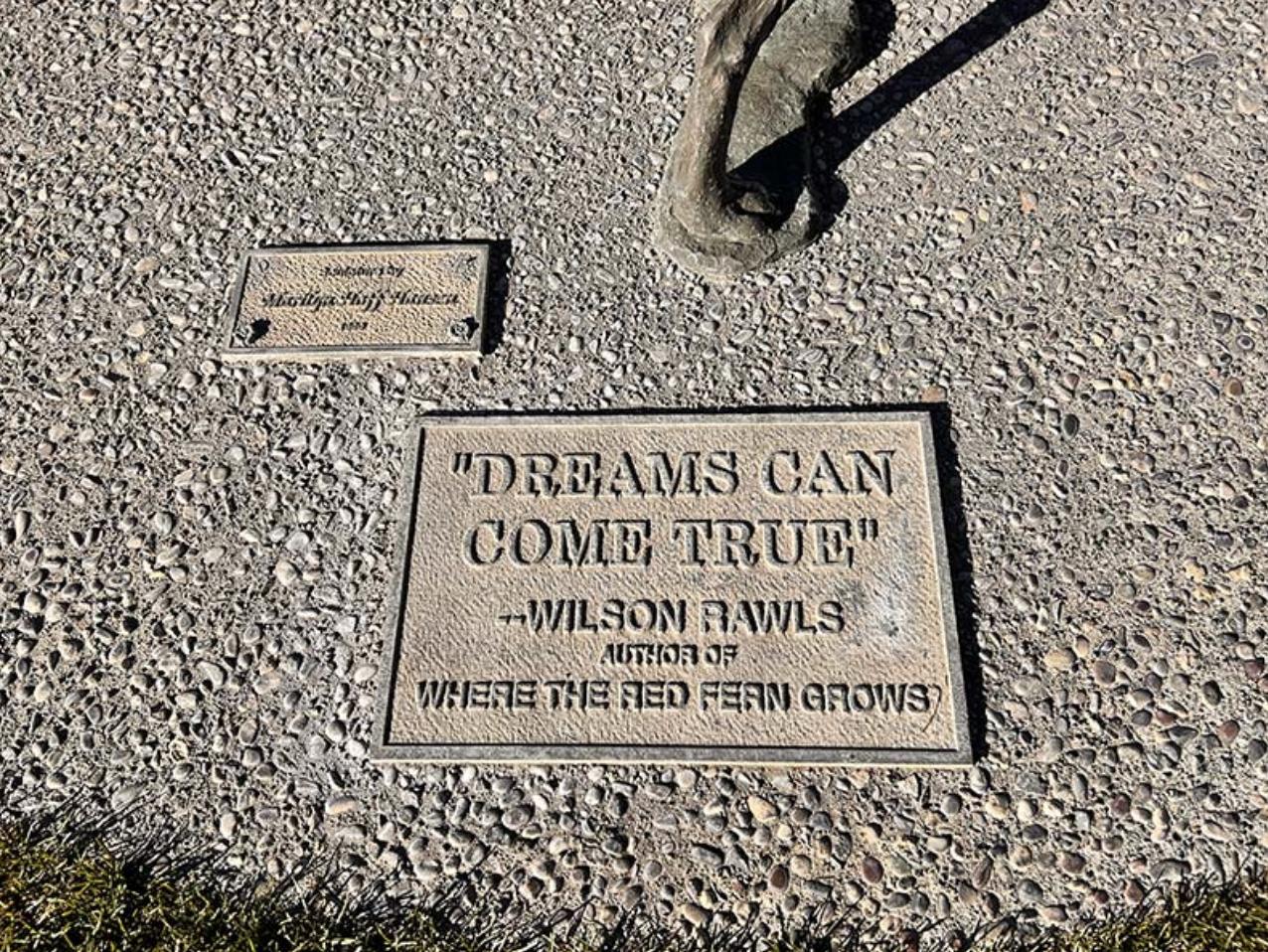 A memorial placard is on the back side of Marilyn Hoff Hansen’s sculpture.