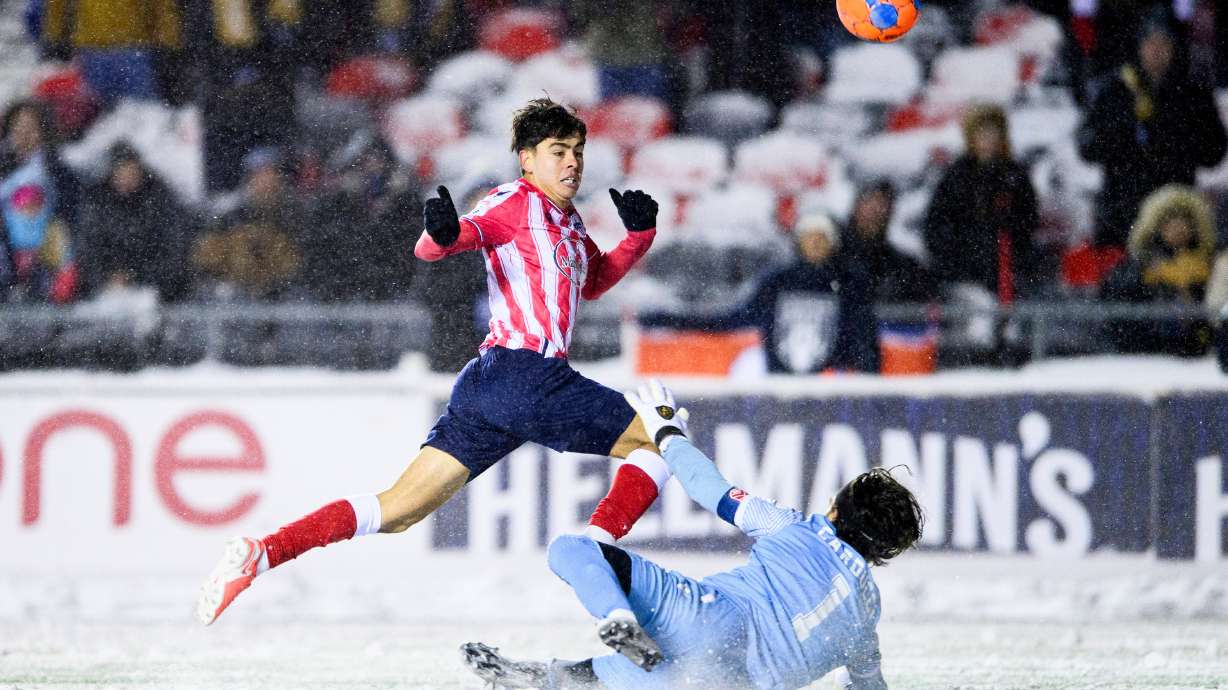 Atletico Ottawa's David RodrÃguez (7) scores on Cavalry FC's Ali Musse (7) during extra time Canadian Premier League finals soccer action in Ottawa, on Sunday, Nov. 9, 2025.