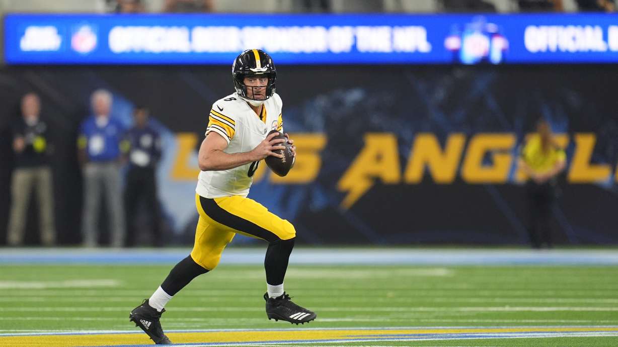 Pittsburgh Steelers quarterback Aaron Rodgers (8) pulls back to throw a pass during the first half of an NFL football game against the Los Angeles Chargers Sunday, Nov. 9, 2025, in Inglewood, Calif.
