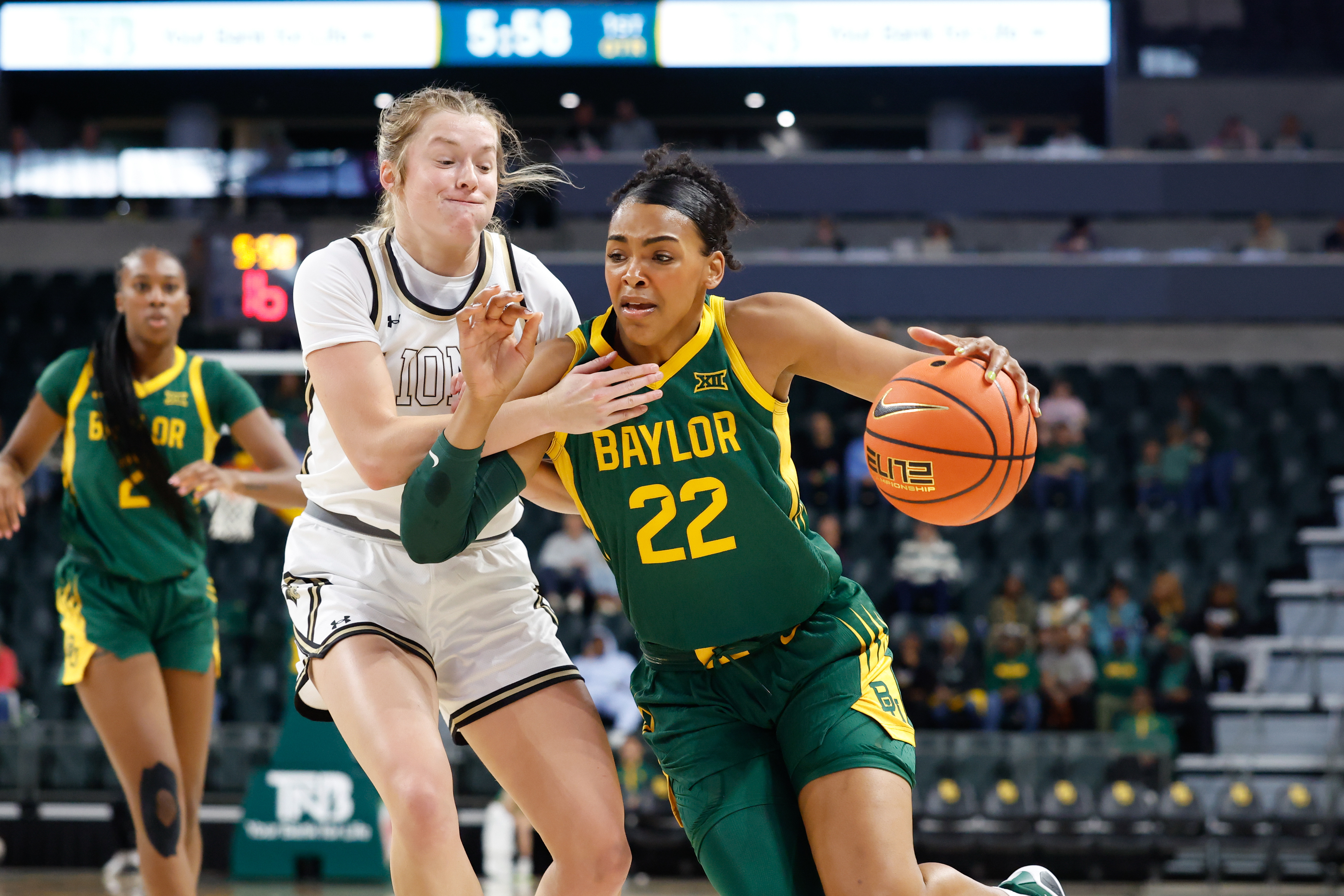Baylor forward Bella Fontleroy (22) drives to the basket against Lindenwood guard Ellie Brueggemann, front left, in the first half of an NCAA college basketball game, Sunday, Nov. 9, 2025, in Waco, Texas.